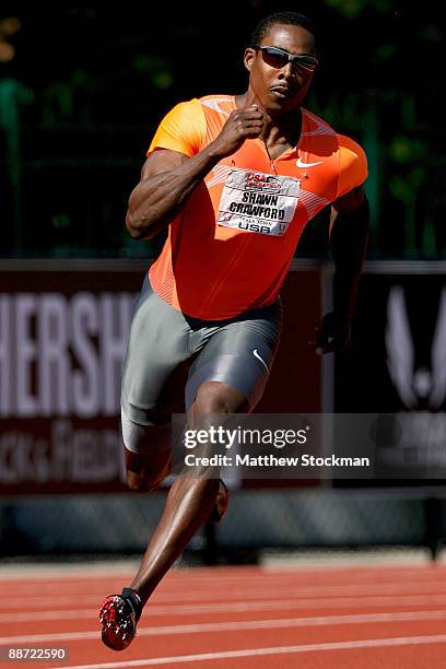 Shawn Crawford competes in the first round of the 200 meter event during the USA Outdoor Track & Field Championships at Hayward Field on June 27,...