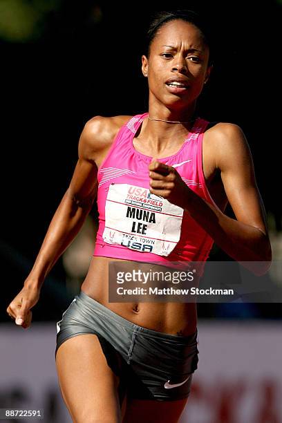 Muna Lee competes in the first round of the 200 meter event during the USA Outdoor Track & Field Championships at Hayward Field on June 27, 2009 in...