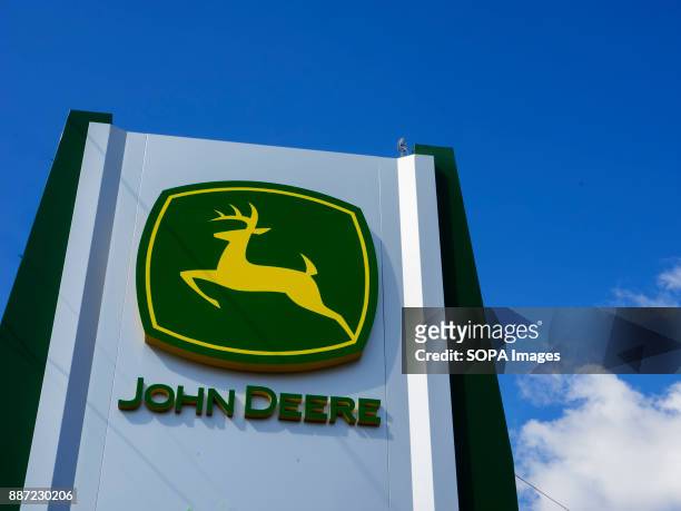 John Deere sign seen on a panel. John Deere is an American corporation that manufactures agricultural, construction, and forestry machinery, diesel...