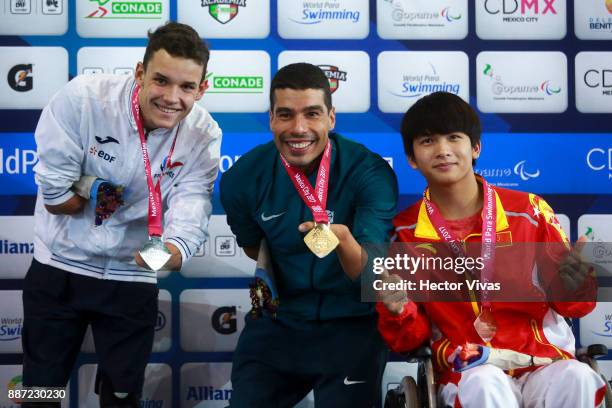 Theo Curin of France , Daniel Dias of Brazil and Li Jusheng of Chine pose after the Men's 200m Freestyle S5 Final during day 5 of the Para Swimming...