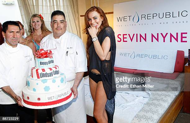 Actress Lindsay Lohan is presented with a birthday cake as she appears at the Wet Republic pool at the MGM Grand Hotel/Casino to celebrate her...