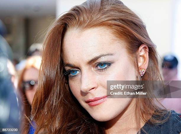 Actress Lindsay Lohan is interviewed as she arrives at the Wet Republic pool at the MGM Grand Hotel/Casino to celebrate her birthday and her Sevin...