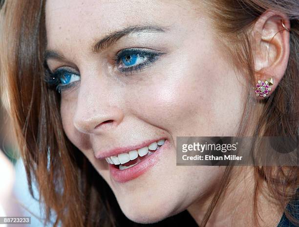 Actress Lindsay Lohan is interviewed as she arrives at the Wet Republic pool at the MGM Grand Hotel/Casino to celebrate her birthday and her Sevin...