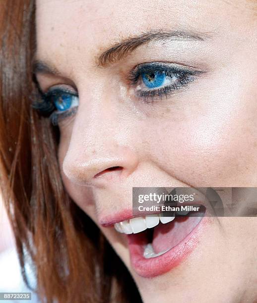 Actress Lindsay Lohan is interviewed as she arrives at the Wet Republic pool at the MGM Grand Hotel/Casino to celebrate her birthday and her Sevin...