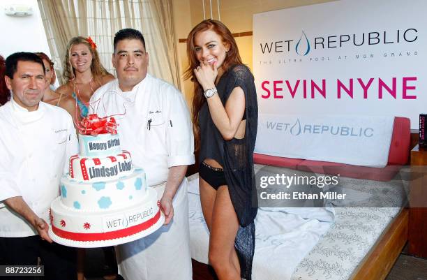 Actress Lindsay Lohan is presented with a birthday cake as she appears at the Wet Republic pool at the MGM Grand Hotel/Casino to celebrate her...