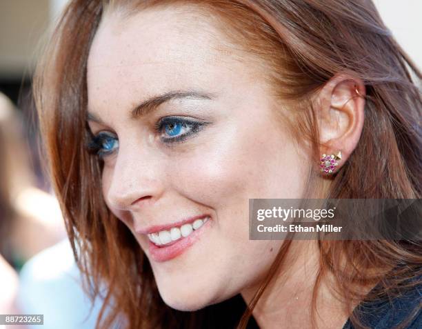 Actress Lindsay Lohan is interviewed as she arrives at the Wet Republic pool at the MGM Grand Hotel/Casino to celebrate her birthday and her Sevin...