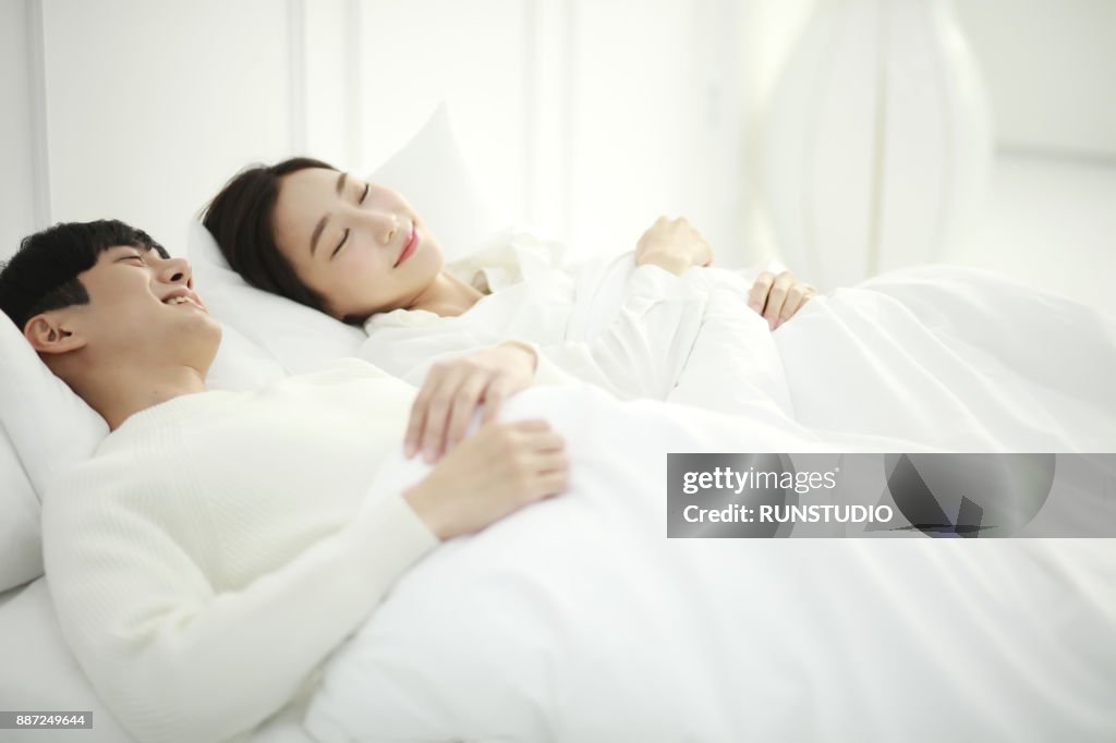 Couple sleeping in Bed together