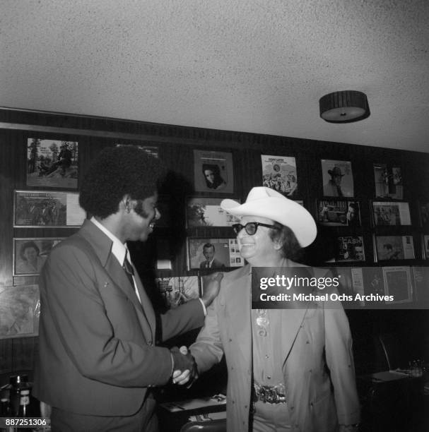 Country singer and songwriter O. B. McClinton and designer Nudie Cohn pose for a photo at a press party at The Palomino Club on March 20, 1972 in the...