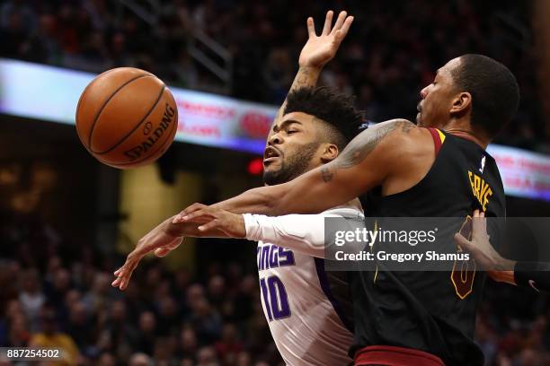 Frank Mason III of the Sacramento Kings drives to the basket but is fouled by Channing Frye of the Cleveland Cavaliers during the first half at...