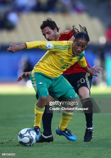 Steven Pienaar of South Africa is challenged by Santiago Cazorla Gonzalez of Spain in action during the FIFA Confederations Cup 3rd Place Playoff...