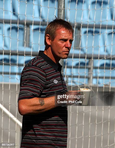 Stuart Pearce, manager of England U21, drinks during an walk about in the New Stadium instead of training ahead of their UEFA European Under-21...