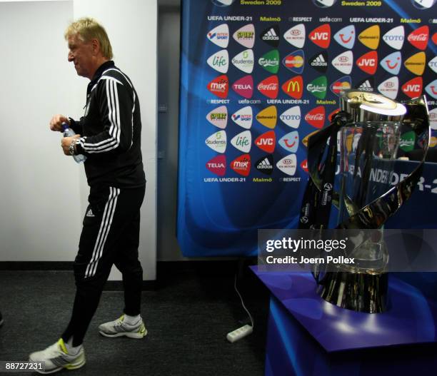 Horst Hrubesch, Head coach of Germany U21 walks along the U21 Trophy during press conference ahead of their UEFA European Under-21 Championship Final...