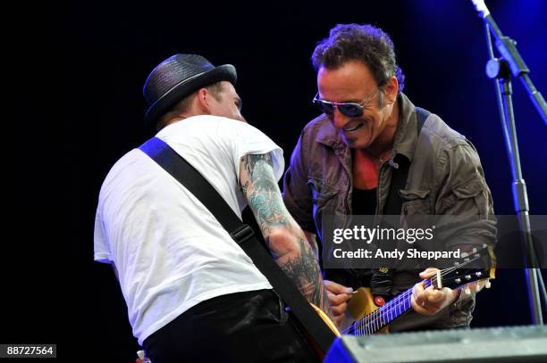 Bruce Springsteen performs on stage with Brian Fallon of The Gaslight Anthem on the last day of Hard Rock Calling 2009 in Hyde Park on June 28, 2009...