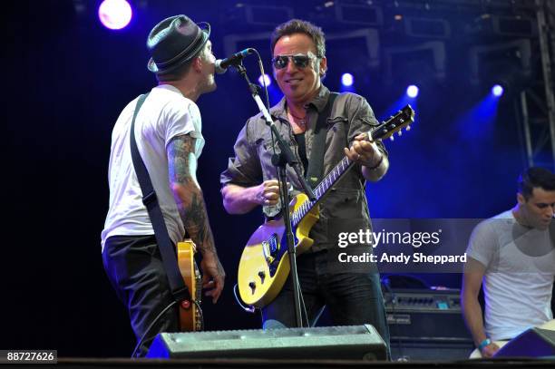 Bruce Springsteen performs on stage with Brian Fallon of The Gaslight Anthem on the last day of Hard Rock Calling 2009 in Hyde Park on June 28, 2009...