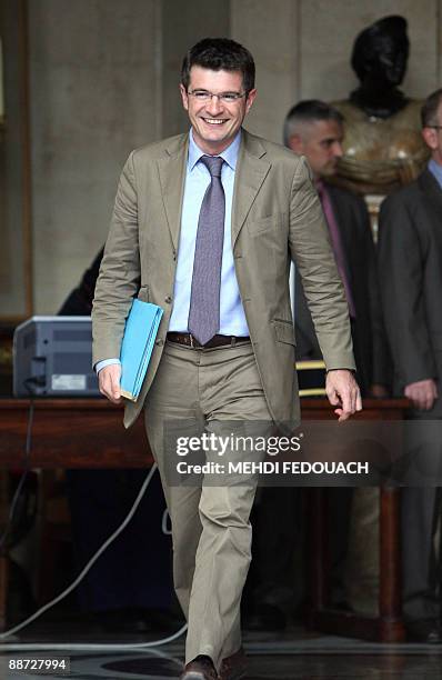 French Junior Minister for housing and urban affairs Benoist Apparu leaves after a meeting aimed at defining French president Nicolas Sarkozy's...