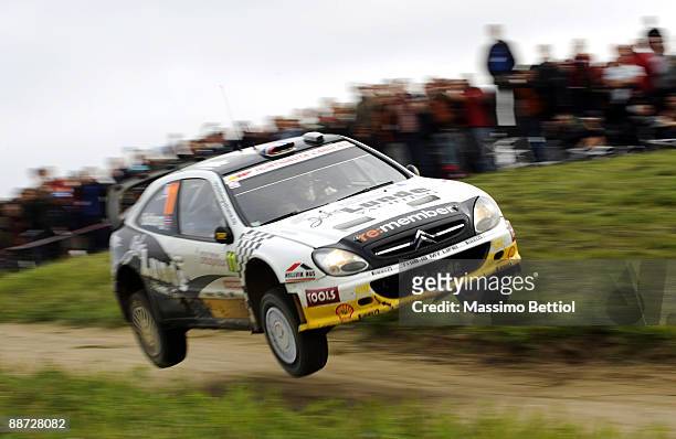 Petter Solberg of Norway and Phil Mills of Great Britain compete in their Citroen Xsara during the third leg of the WRC Rally of Poland on June 28,...