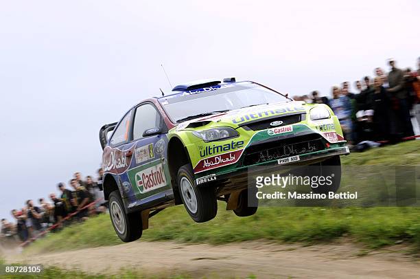 Mikko Hirvonen and Jarmo Lehtinen of Finland compete in their BP Abu Dhabi Ford Focus during the third leg of the WRC Rally of Poland on June 28,...