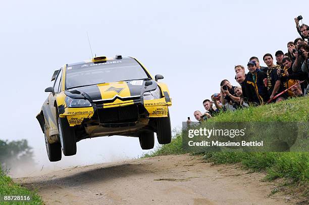 Evgeny Novikov of Russia and Dale Moscatt of Australia compete in their Citroen C4 Junior Team during the third leg of the WRC Rally of Poland on...