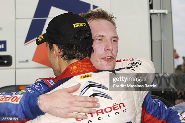 Daniel Sordo of Spain consoles Jari Matti Latvala of Finland after he crashed out during the last stage of the third leg of the WRC Rally of Poland...