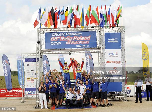 Mikko Hirvonen and Jarmo Lehtinen of Finland celebrate their victory with the BP Abu Dhabi Ford Rally Team during the WRC Rally of Poland on June 28,...