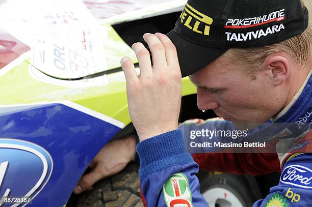 Jari Matti Latvala of Finland inspects the damage to his BP Abu Dhabi Ford Focus after crashing during the last stage of third leg of the WRC Rally...