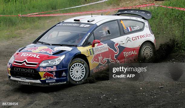 Sebastien Loeb of France with his co-pilot Elena Daniel of Monaco drives his Citroen C4 during the 66th Rally of Poland in Mikolajki on June 28,...