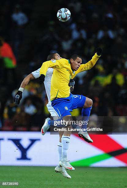 Oguchi Onyewu of USA competes with Luis Fabiano of Brazil during the FIFA Confederations Cup Final between USA and Brazil at the Ellis Park Stadium...