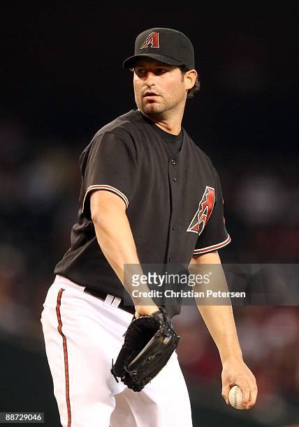 Starting pitcher Doug Davis of the Arizona Diamondbacks pitches against the Los Angeles Angels of Anaheim during the major league baseball game at...