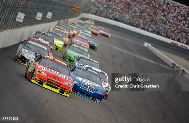 Jeff Gordon, driver of the DuPont Chevrolet, leads Kurt Busch, driver of the Miller Lite Dodge, during the NASCAR Sprint Cup Series LENOX Industrial...