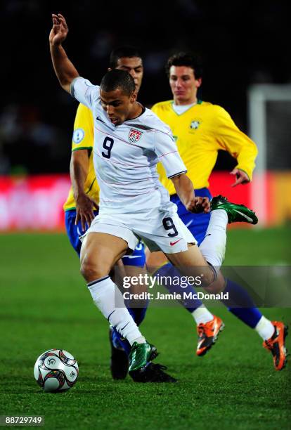 Charlie Davies of USA breaks through the Brazil defence during the FIFA Confederations Cup Final between USA and Brazil at the Ellis Park Stadium on...