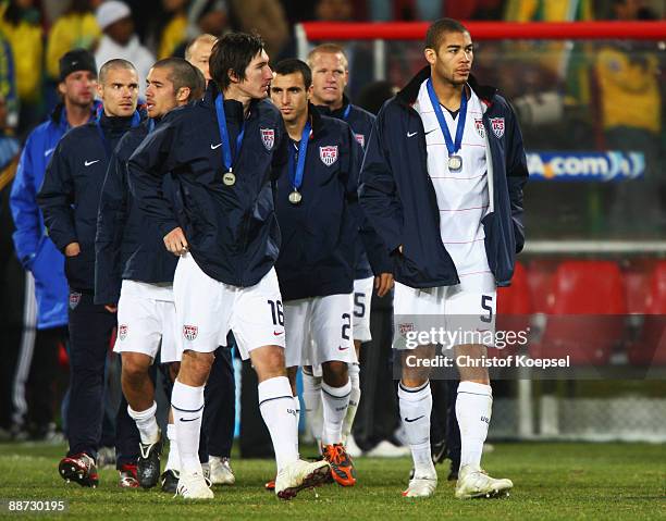 Sacha Kljestan and Oguchi Onyewu of USA look dejected after defeat in the FIFA Confederations Cup Final between USA and Brazil at the Ellis Park...
