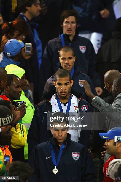 Oguchi Onyewu of USA and his team mates collect their losers medals at the end of the FIFA Confederations Cup Final match between USA and Brazil at...