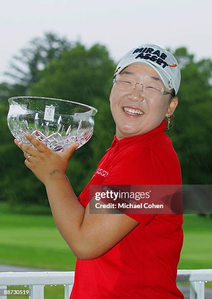 Jiyai Shin of South Korea holds the trophy after winning the Wegmans LPGA at Locust Hill Country Club held on June 28, 2009 in Pittsford, NY.