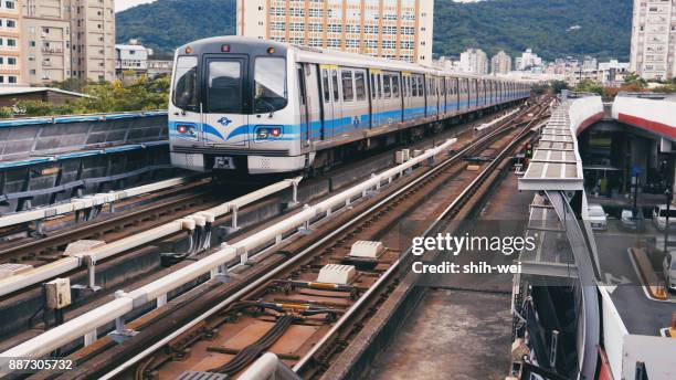 taipei, taiwan - june 27: this is a view of an mrt train in the zhongxiao fuxing downtown area on june 27, 2017 in taipei - taipei mrt stock pictures, royalty-free photos & images