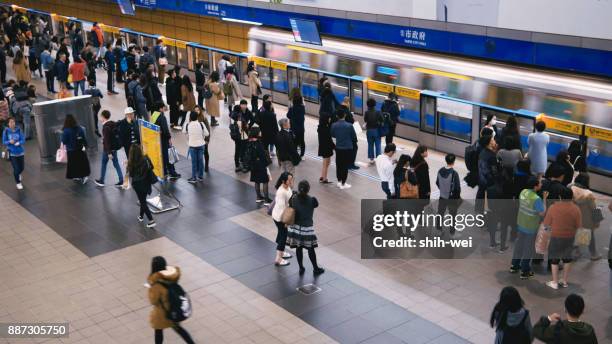 taipei, taiwan - june 27: this is a view of an mrt train in the zhongxiao fuxing downtown area on june 27, 2017 in taipei - taipei mrt stock pictures, royalty-free photos & images