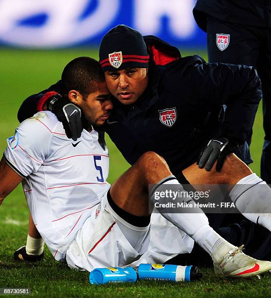 Oguchi Onyewu of the USA is consoled by a teammate after their defeat to Brazil during the FIFA Confederations Cup Final match between USA and Brazil...