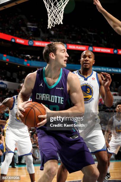 Cody Zeller of the Charlotte Hornets handles the ball against the Golden State Warriors on December 6, 2017 at Spectrum Center in Charlotte, North...