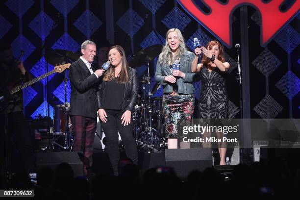 View of the Capital One winner onstage with Elvis Duran and the cast of The Morning Show during Q102's Jingle Ball 2017 Presented by Capital One at...