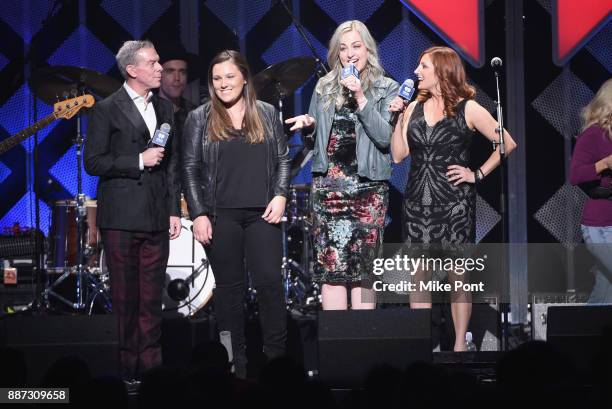 View of the Capital One winner onstage with Elvis Duran and the cast of The Morning Show during Q102's Jingle Ball 2017 Presented by Capital One at...