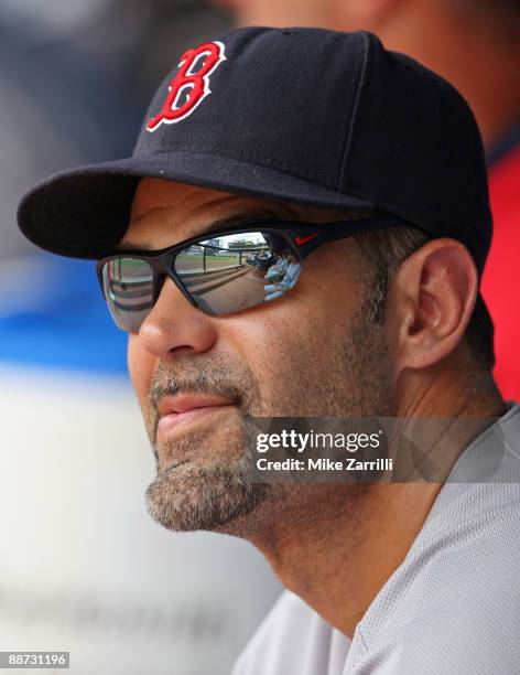 Infielder Mike Lowell of the Boston Red Sox watches the scoreboard during the game against the Atlanta Braves at Turner Field on June 28, 2009 in...