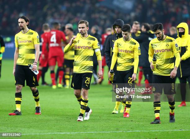 Neven Subotic of Dortmund, Marcel Schmelzer of Dortmund, Christian Pulisic of Dortmund and Nuri Sahin of Dortmund look dejected after the Bundesliga...