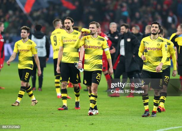 Raphael Guerreiro of Dortmund, Neven Subotic of Dortmund, Marcel Schmelzer of Dortmund and Nuri Sahin of Dortmund look dejected after the Bundesliga...