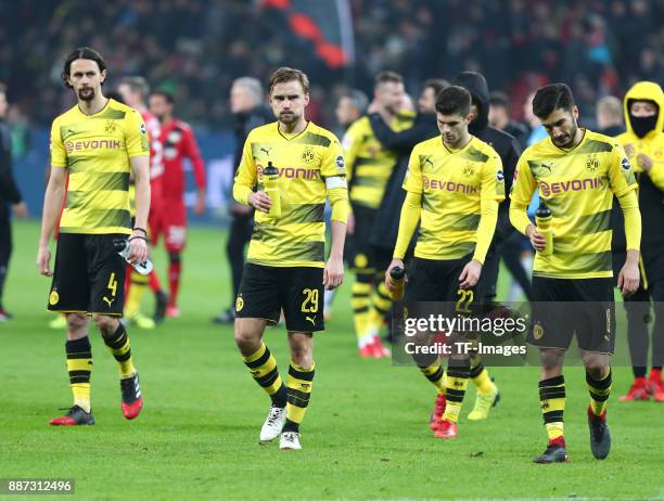 Neven Subotic of Dortmund, Marcel Schmelzer of Dortmund, Christian Pulisic of Dortmund and Nuri Sahin of Dortmund look dejected after the Bundesliga...