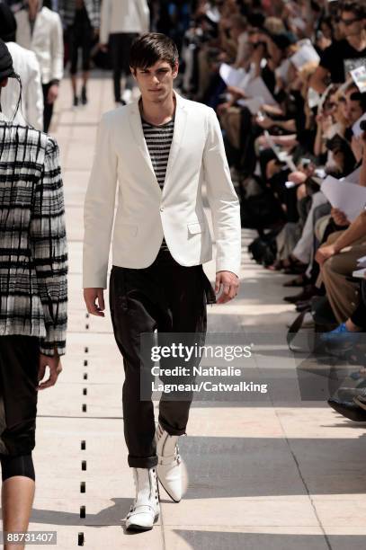 Model walks the runway during the Masatomo fashion show at Paris Fashion Week Menswear Spring/Summer 2010 at Hotel Saint-James & Albany on June 28,...