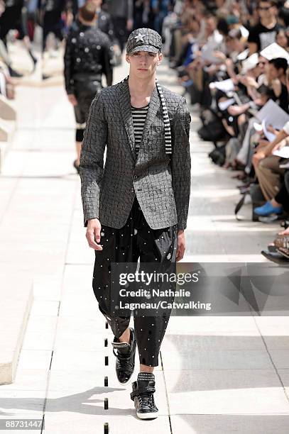 Model walks the runway during the Masatomo fashion show at Paris Fashion Week Menswear Spring/Summer 2010 at Hotel Saint-James & Albany on June 28,...