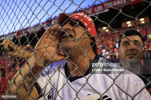 Fan of Independiente cheers his team during the first leg of the Copa Sudamericana 2017 final between Independiente and Flamengo at Estadio...