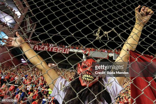 Fan of Independiente cheers his team during the first leg of the Copa Sudamericana 2017 final between Independiente and Flamengo at Estadio...