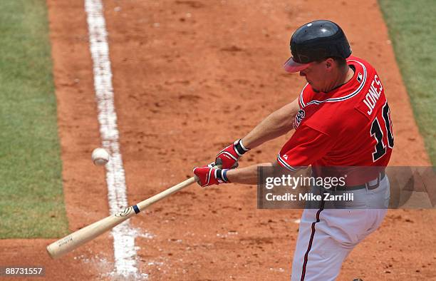 Third baseman Chipper Jones of the Atlanta Braves swings at a pitch during the game against the Boston Red Sox at Turner Field on June 28, 2009 in...