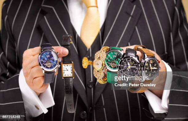 black market trader selling stolen watches - medium group of objects stock pictures, royalty-free photos & images