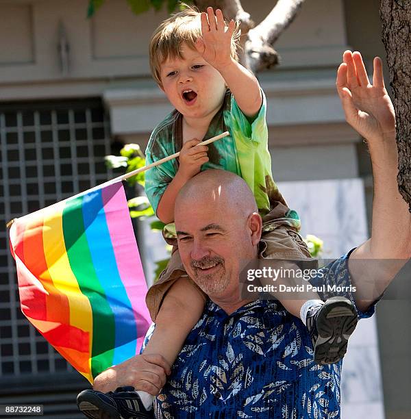 Mike Ryan holds his son Jacob, 4 on his shoulders as they watch the 39th annual gay pride parade June 28, 2009 in San Francisco, California. The 39th...